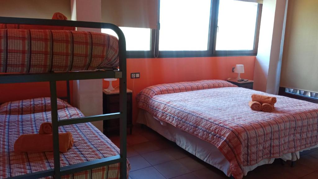 Postel nebo postele na pokoji v ubytování HOTEL PASTERAL RIU TER