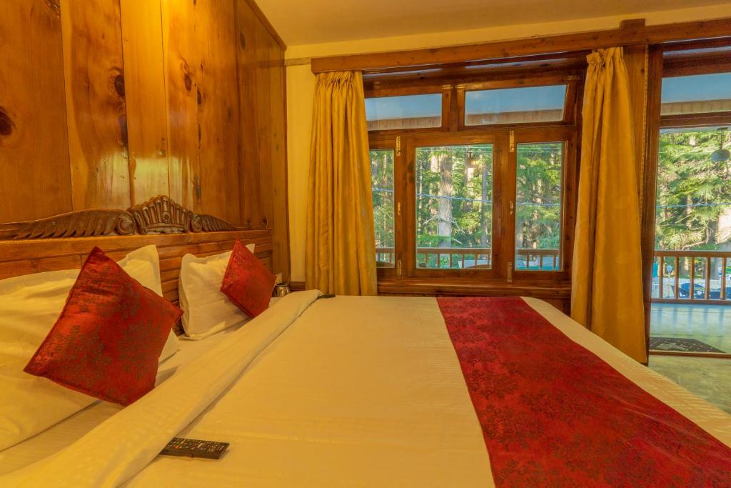 Postel nebo postele na pokoji v ubytování Holiday Home International -Vivaan Stays