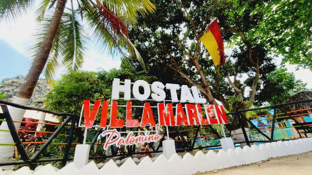 a sign for a hotel in a amusement park at Villa Marlen Palomino in Palomino