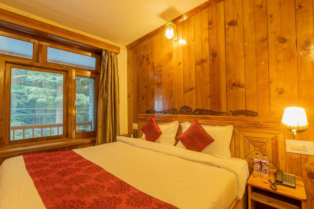 Postel nebo postele na pokoji v ubytování Holiday Home International -Vivaan Stays