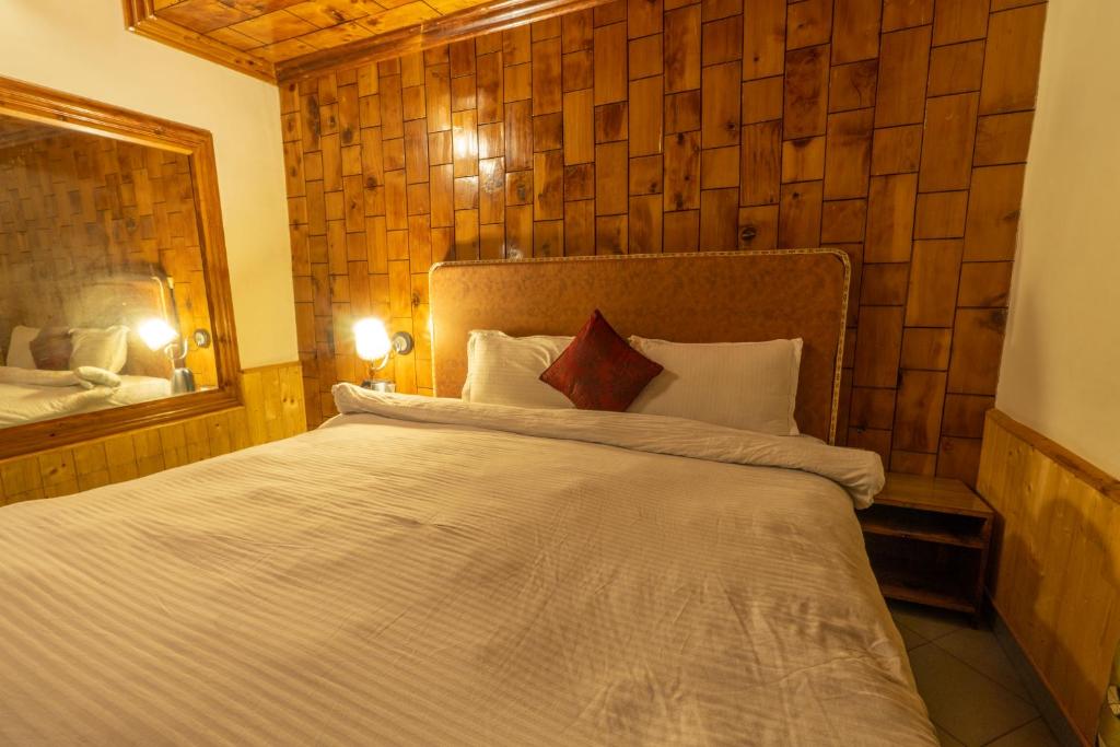 Postel nebo postele na pokoji v ubytování Holiday Home International -Vivaan Stays