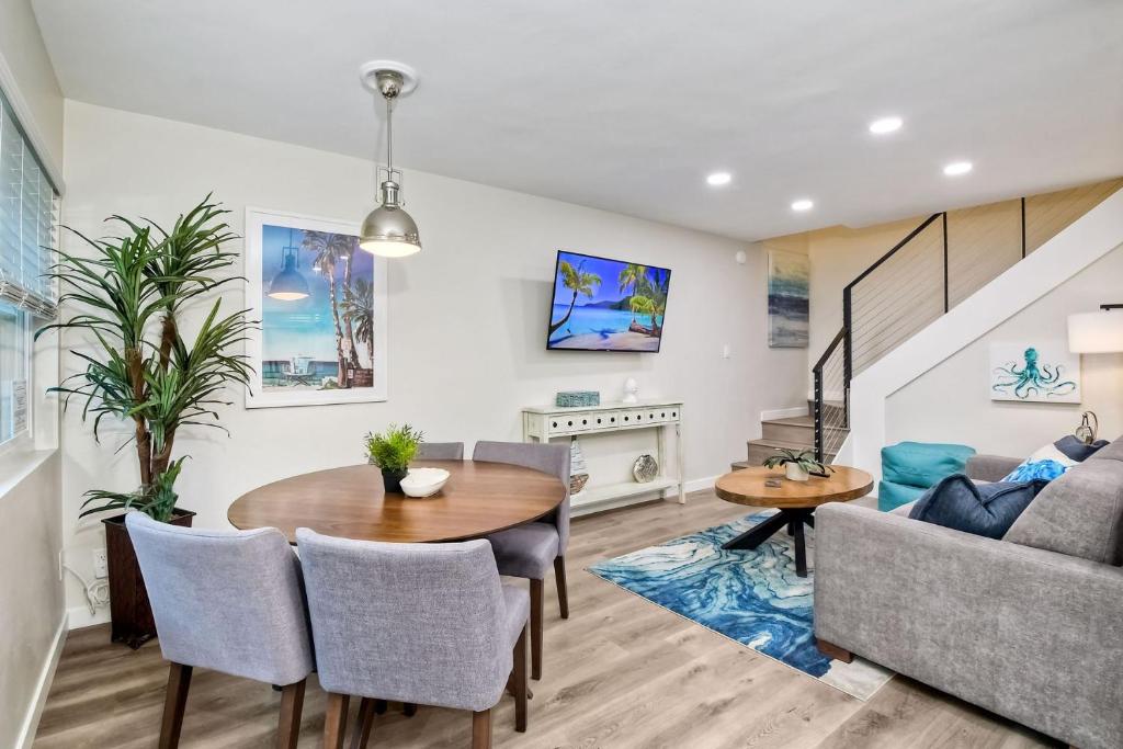 a living room with a table and a couch at Tower 9 D in Oceanside
