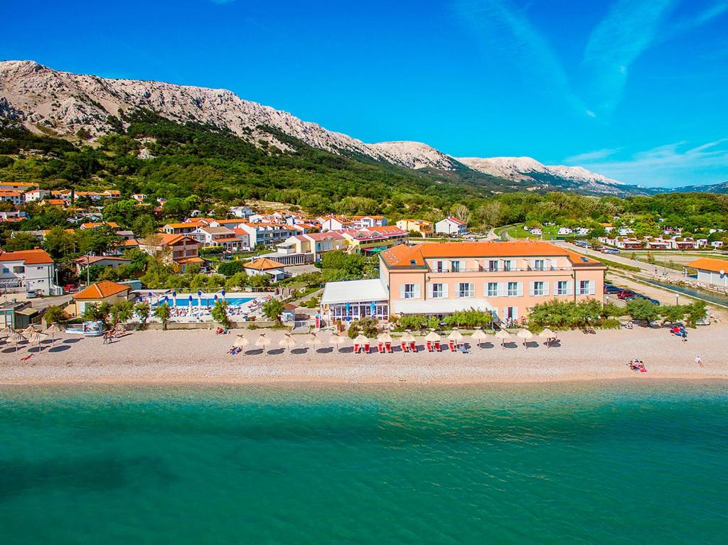 an aerial view of a beach with a resort at Hotel Dobrovit in Baška