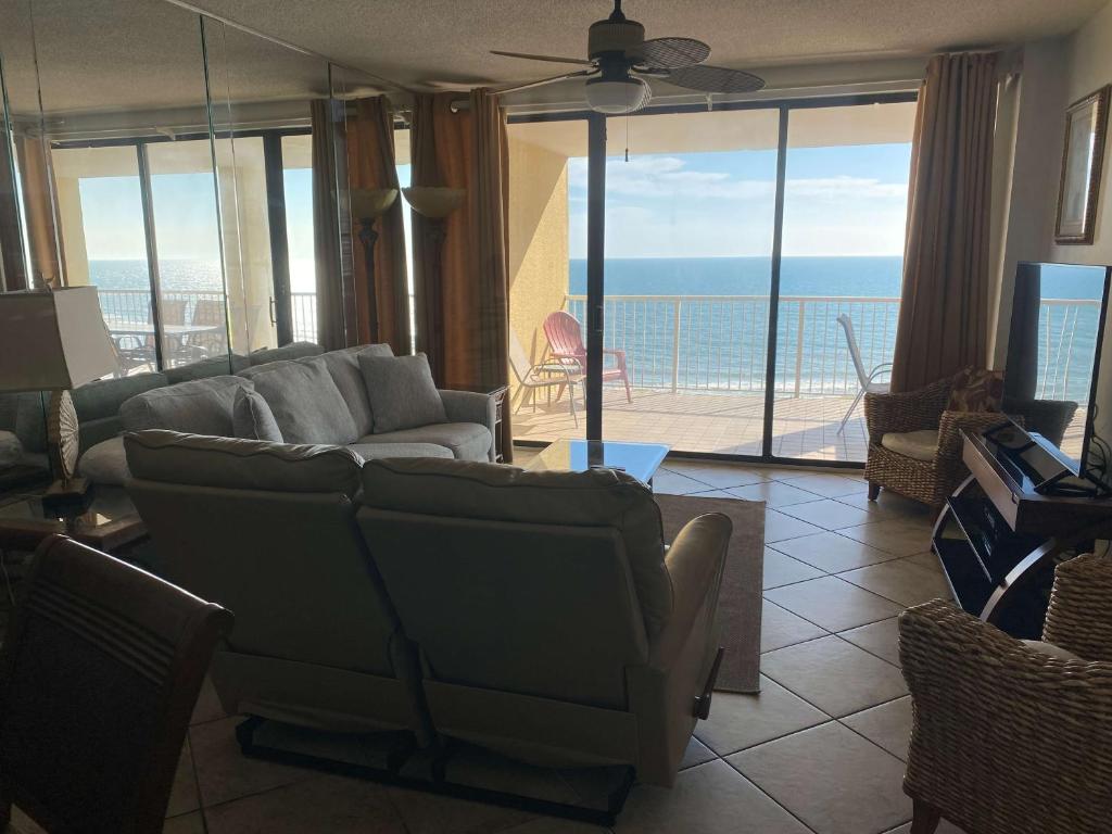 a living room with a view of the ocean at Summer House 703B by ALBVR - Great Beachfront Condo with Oversized Balcony & Amazing Views! in Orange Beach