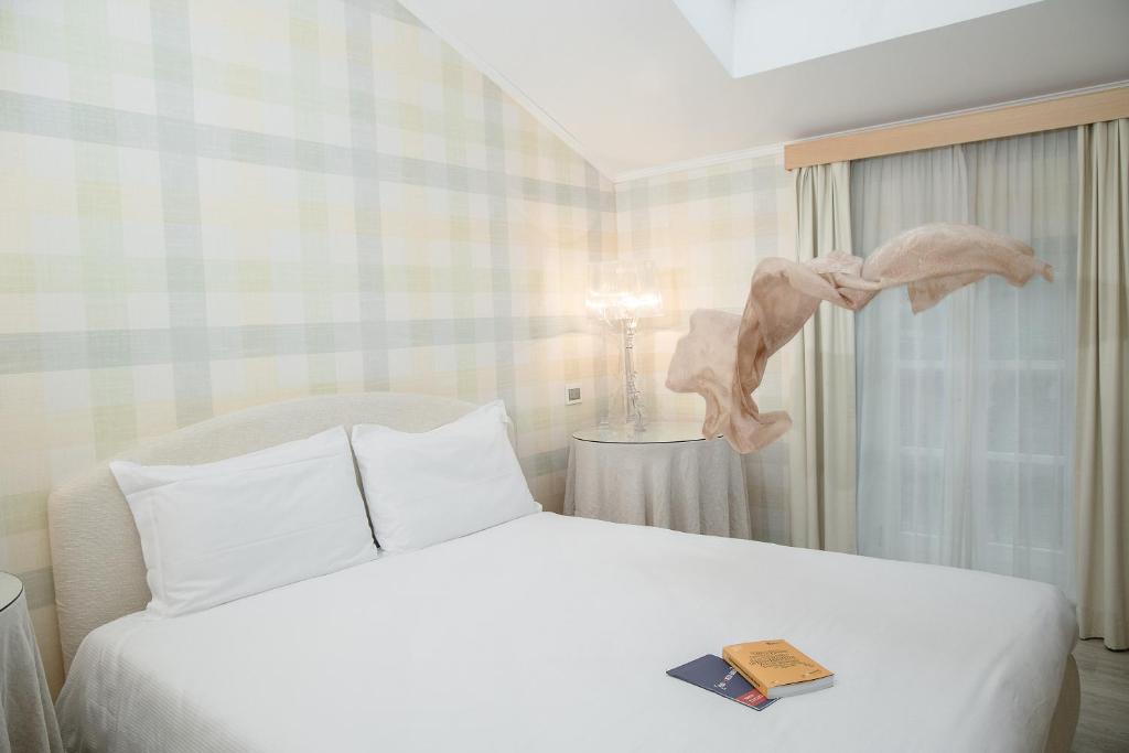 Postel nebo postele na pokoji v ubytování Hotel Eden