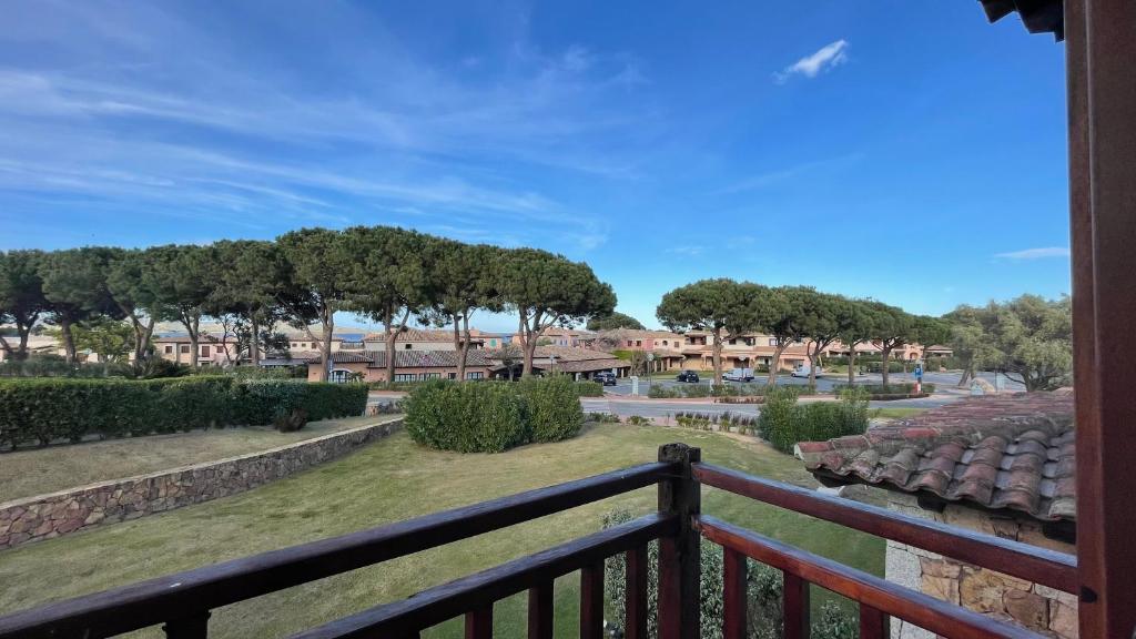 a view of a park from a balcony at Residenze Coda Cavallo - Punta Aldia - Casa delle Sughere in Puntaldia