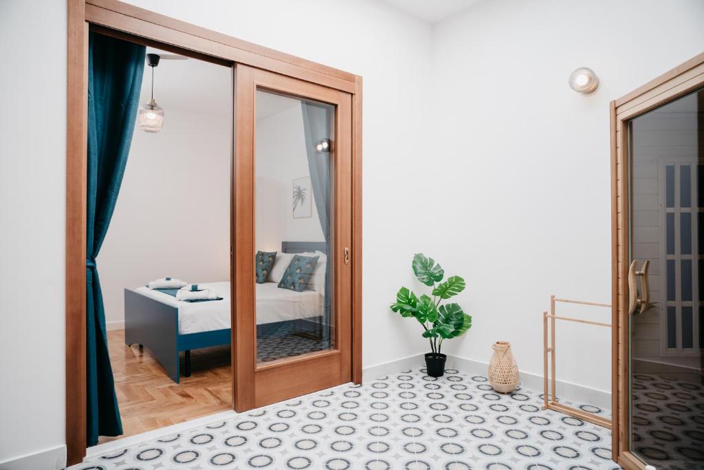 A bed or beds in a room at Vista Napoli Residence by Casa Napoletana