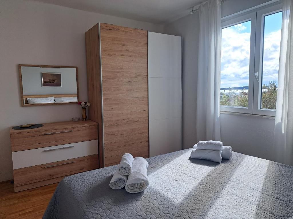 Postel nebo postele na pokoji v ubytování Apartman dida Jakov