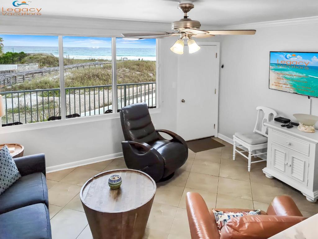 a living room with a view of the ocean at IS9-Cozy Upstairs Beachfront Condo - King Beds in Fort Walton Beach