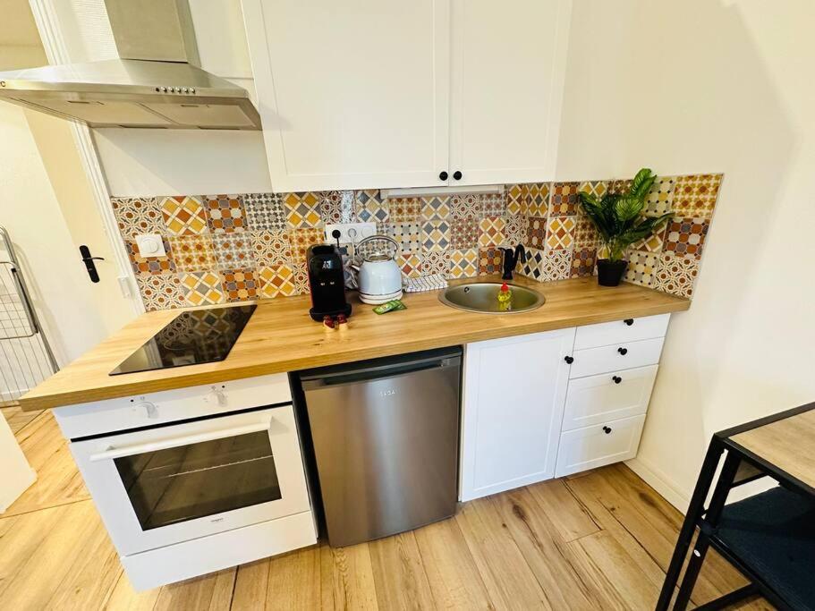 Kuchyňa alebo kuchynka v ubytovaní A2D Bel appartement, Nancy Thermal