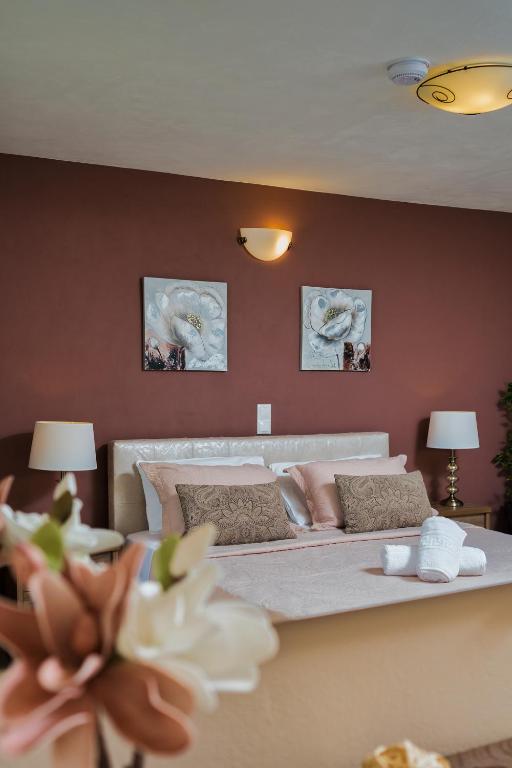 Postel nebo postele na pokoji v ubytování Villa Dionysios