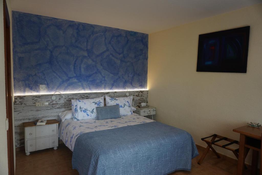Posteľ alebo postele v izbe v ubytovaní Hotel Sant Joan