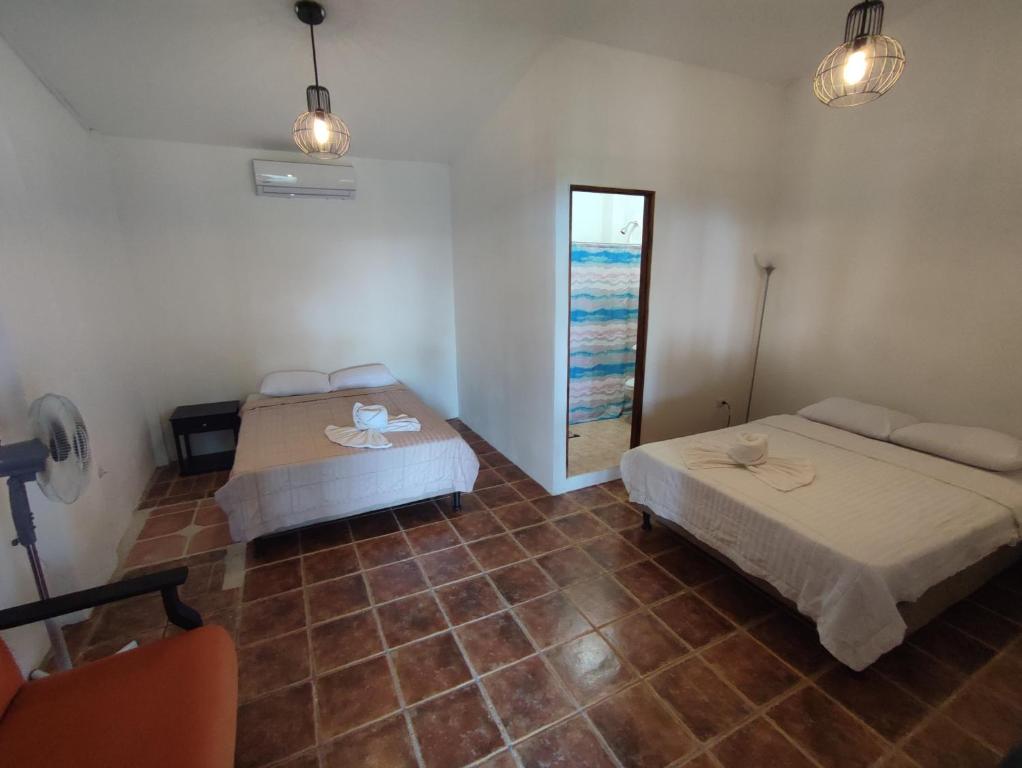 Postel nebo postele na pokoji v ubytování Hostel Plinio