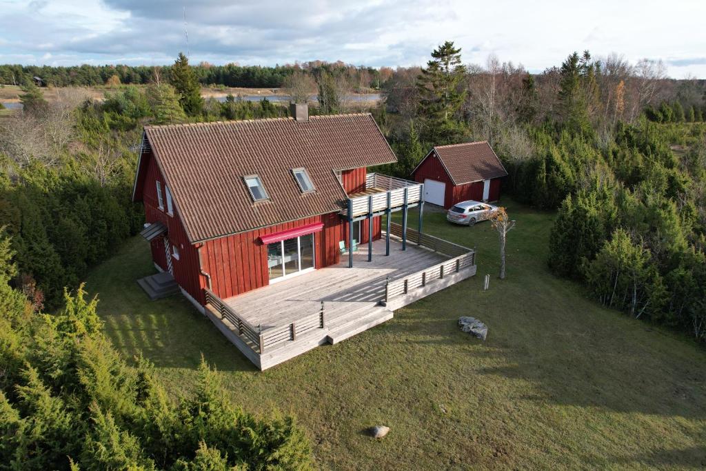 an overhead view of a red house with a deck at Kivika in Lahe