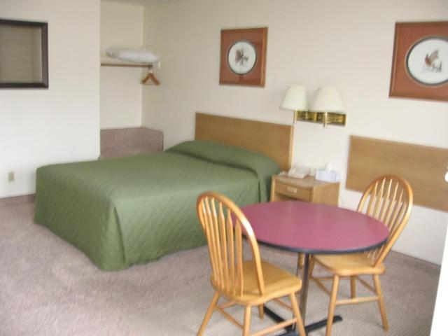 Postel nebo postele na pokoji v ubytování Little Bear Motel