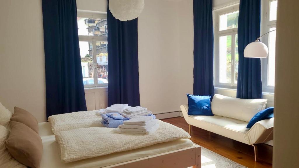 a living room with a couch and a chair at Villa Johanna in Bad Herrenalb