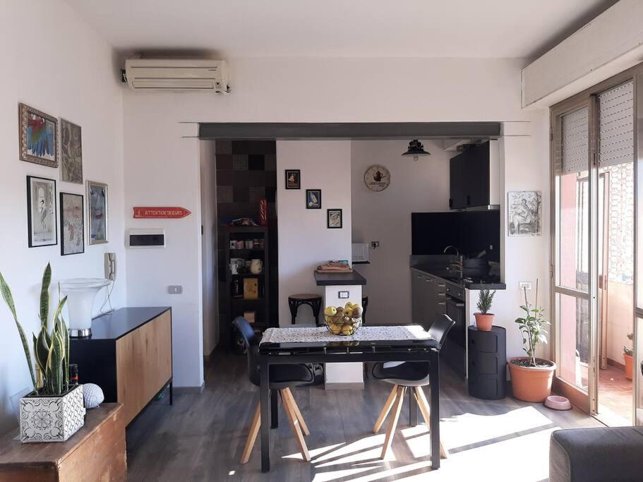 a living room with a table and a television at alpe mare in Marina di Carrara