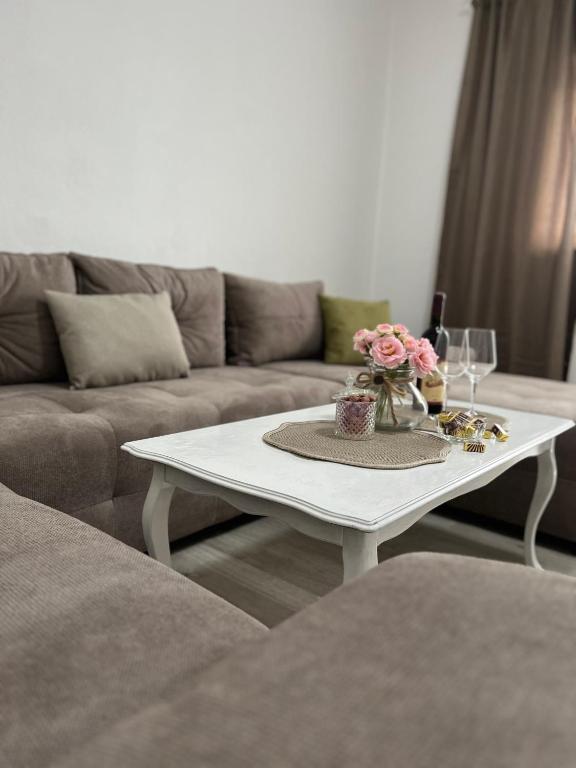 a white coffee table in a living room with a couch at Apartment Ana in Imotski
