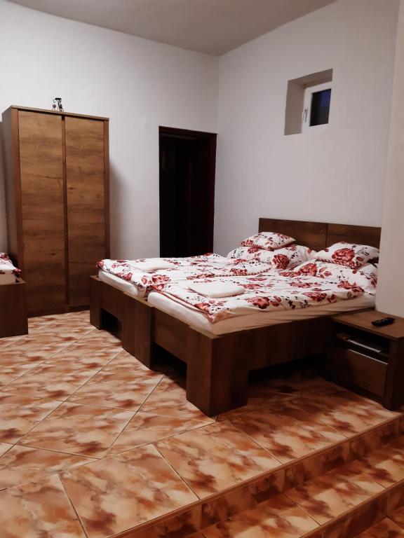 Postel nebo postele na pokoji v ubytování Helga Apartman