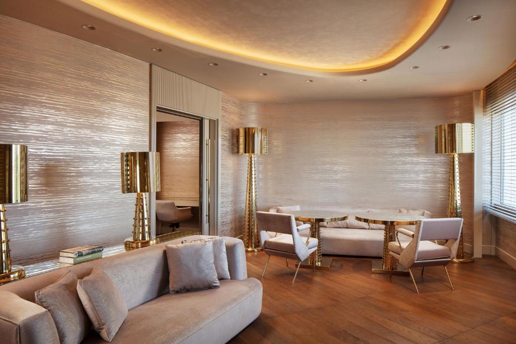a living room with a couch and a table at Sheraton Ankara Hotel & Convention Center in Ankara