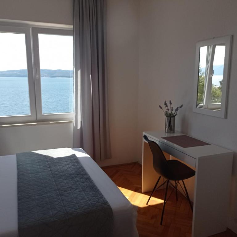 Posteľ alebo postele v izbe v ubytovaní Apartments Mirko