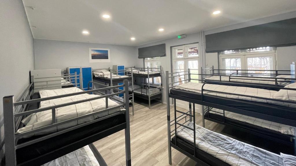 Rúm í herbergi á BP Hostel Gdynia