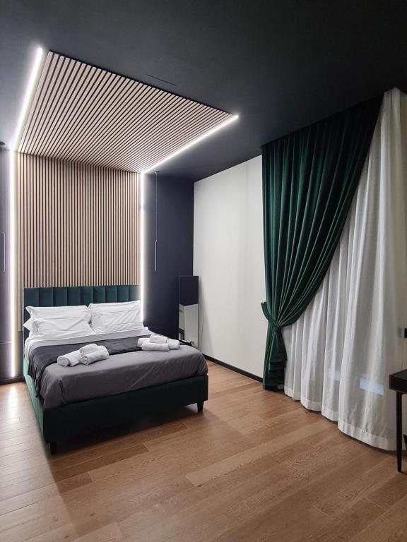 Postelja oz. postelje v sobi nastanitve Chiatamone Luxury Home