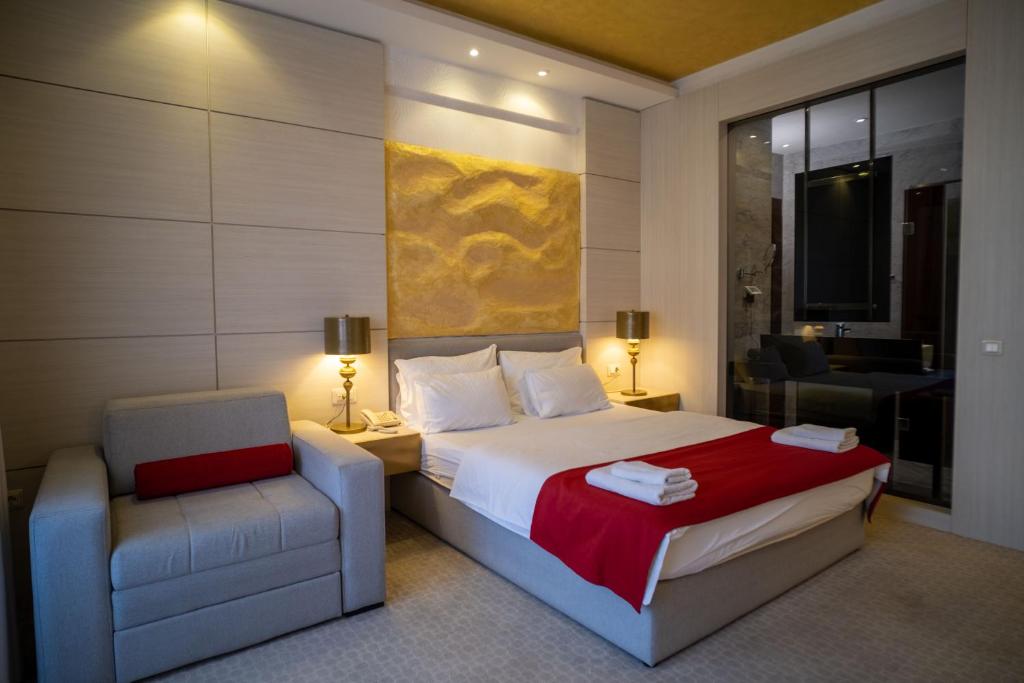 Postel nebo postele na pokoji v ubytování Hotel Atina