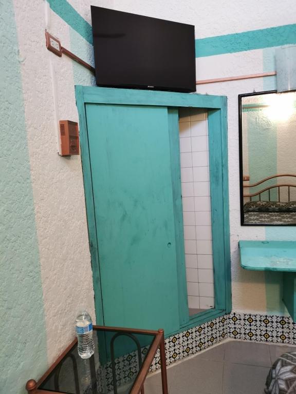 TV a/nebo společenská místnost v ubytování HOTEL LIMÓN