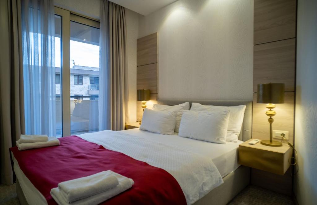 Postel nebo postele na pokoji v ubytování Hotel Atina