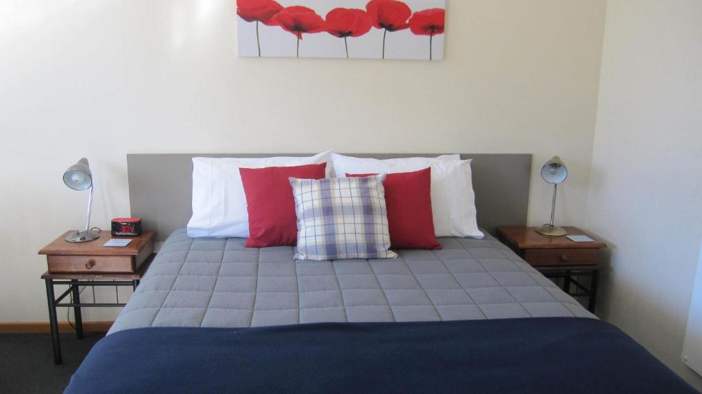 Postel nebo postele na pokoji v ubytování Cromwell Motel