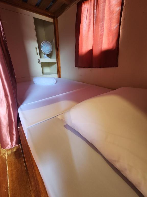 Postel nebo postele na pokoji v ubytování Dam Dam Hostel