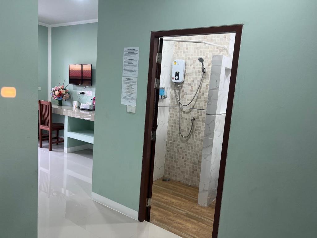 a shower in a bathroom with a glass door at J and Ariya in Bophut 