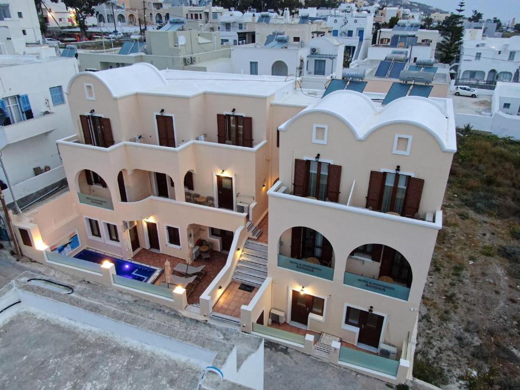 an aerial view of a house with white at Antonia Apartments in Fira
