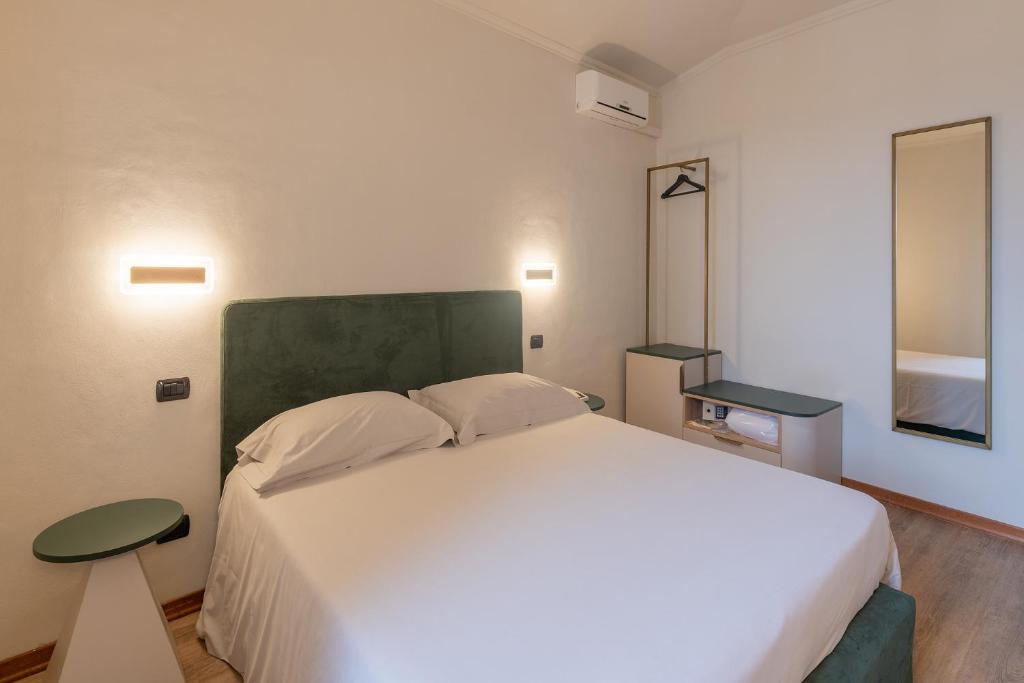 Postel nebo postele na pokoji v ubytování Hotel Gattapone