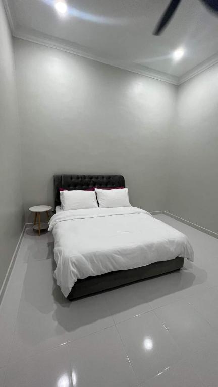 Postel nebo postele na pokoji v ubytování El Manzil Homestay with Pool