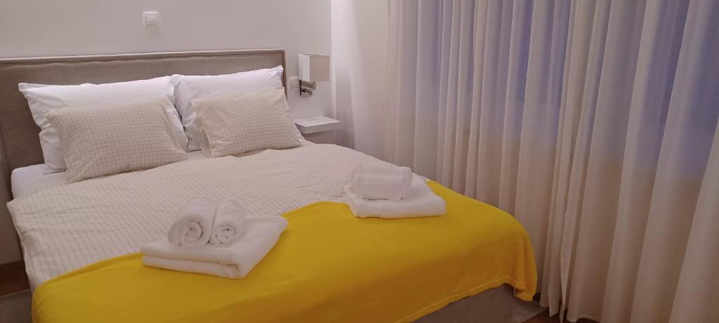 Postel nebo postele na pokoji v ubytování STUDIO APARTMAN FOUR PEARLS