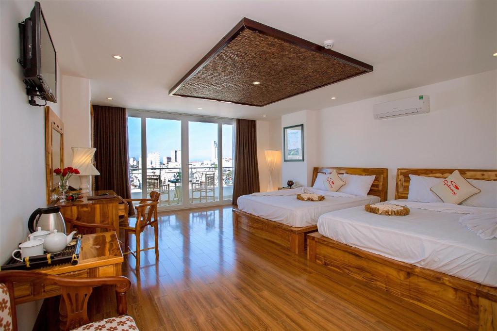 Ένα ή περισσότερα κρεβάτια σε δωμάτιο στο Rex Hotel & Apartment