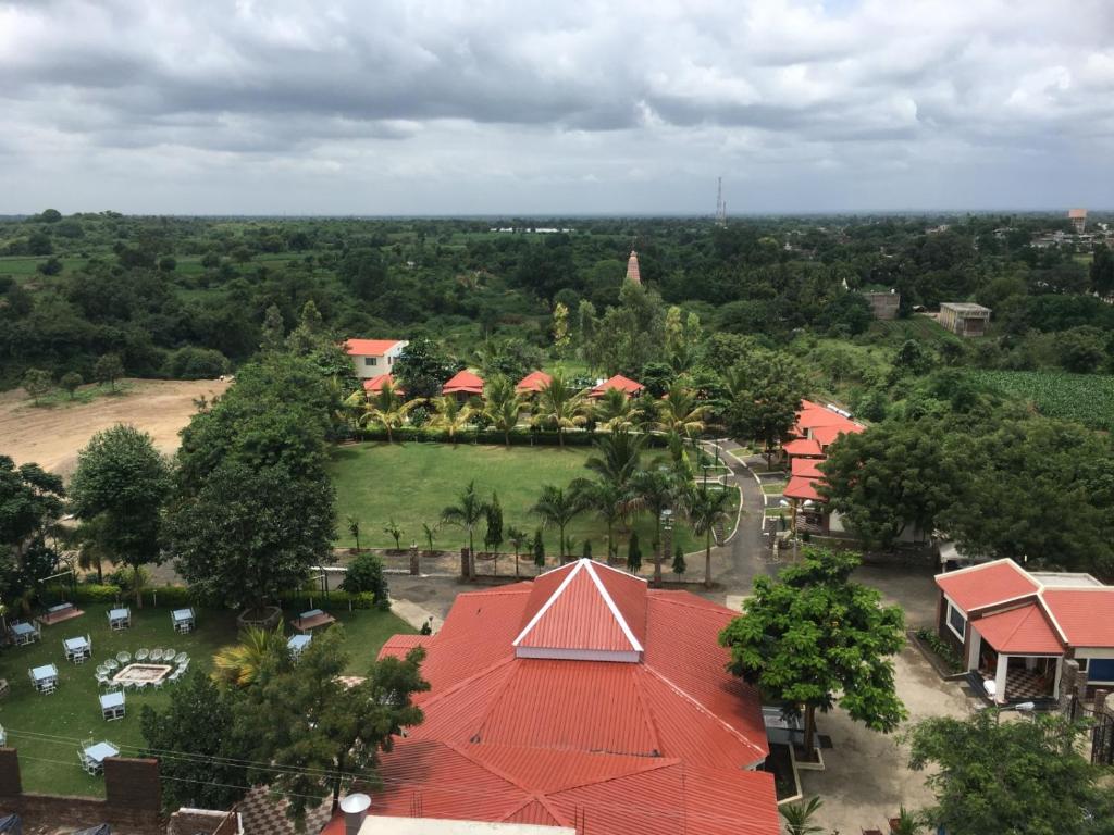 an aerial view of a resort with a park at Ellora Heritage Resort in Ellora