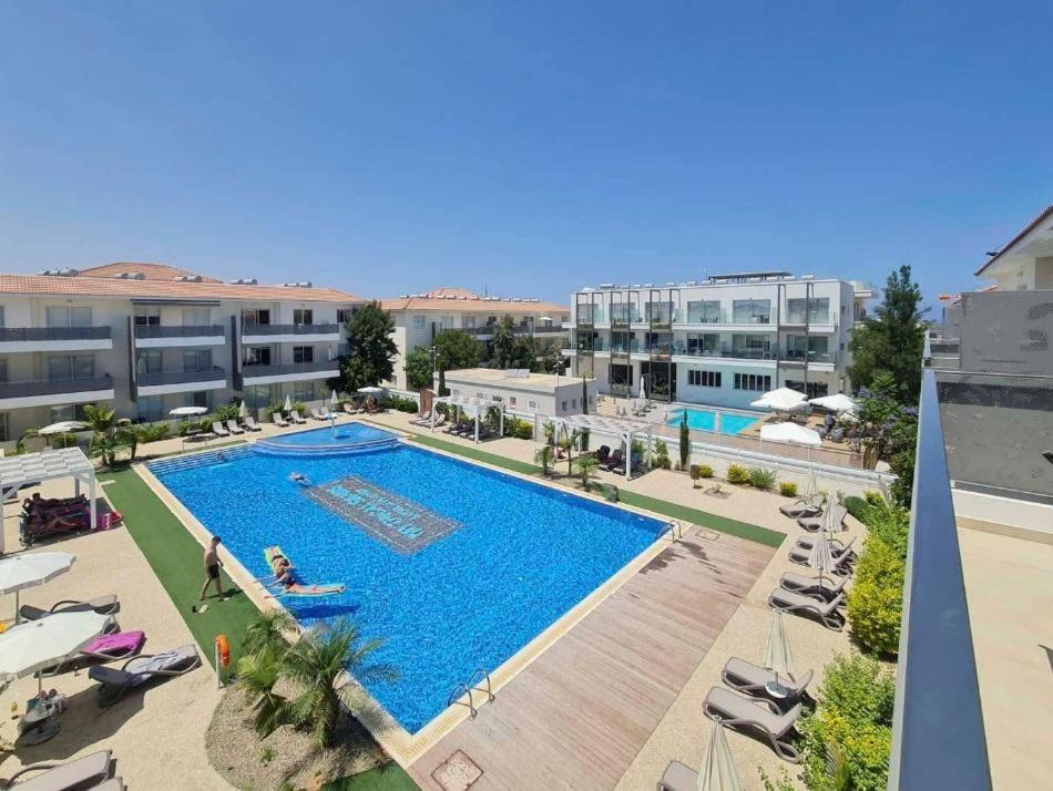 an overhead view of a swimming pool at a hotel at Mythical Sands AM10 in Paralimni