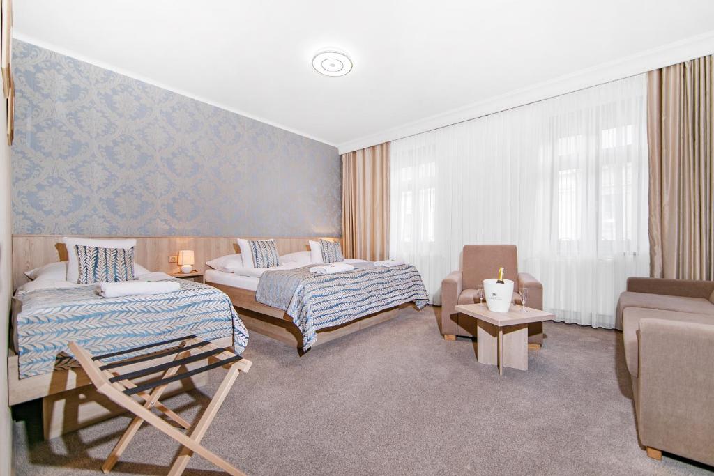 Postel nebo postele na pokoji v ubytování Hotel Roudna