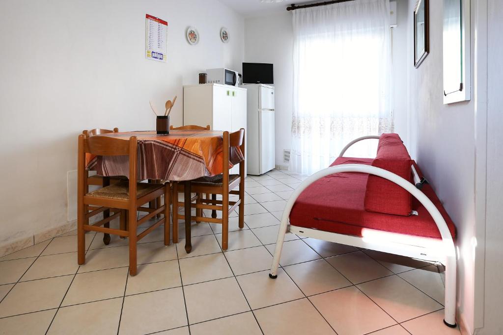 Postel nebo postele na pokoji v ubytování Residence La Pigna