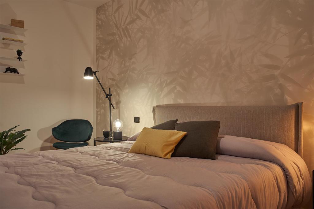 A bed or beds in a room at Bamboo Suite Zona Ripamonti-IEO
