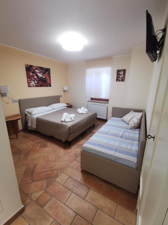 Postel nebo postele na pokoji v ubytování LucyBen GuestHouse
