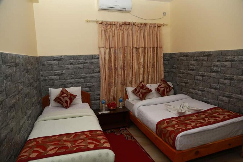 Postel nebo postele na pokoji v ubytování Hotel Center Inn Lake