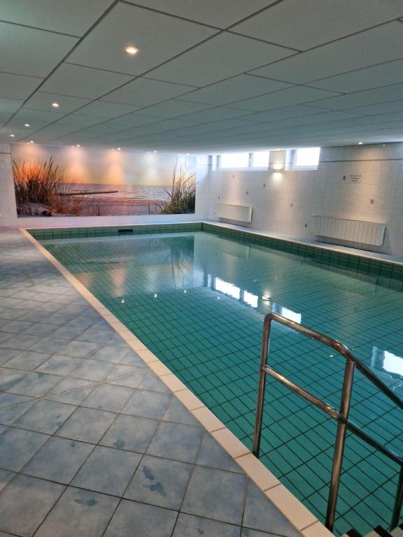 a large swimming pool in a building at Knechtsand 402 in Cuxhaven