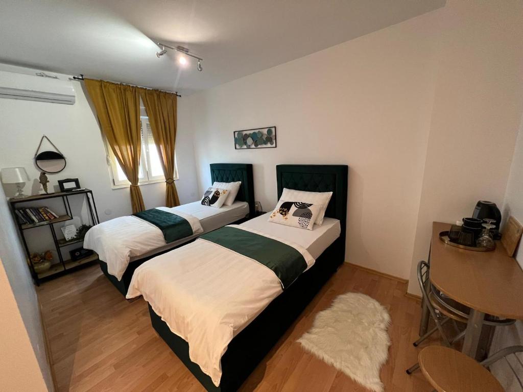 Postel nebo postele na pokoji v ubytování Matic Apartments