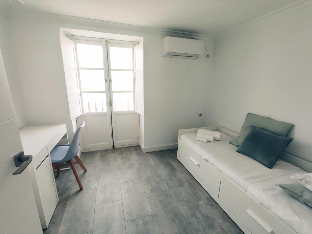 Postel nebo postele na pokoji v ubytování Casa Alameda