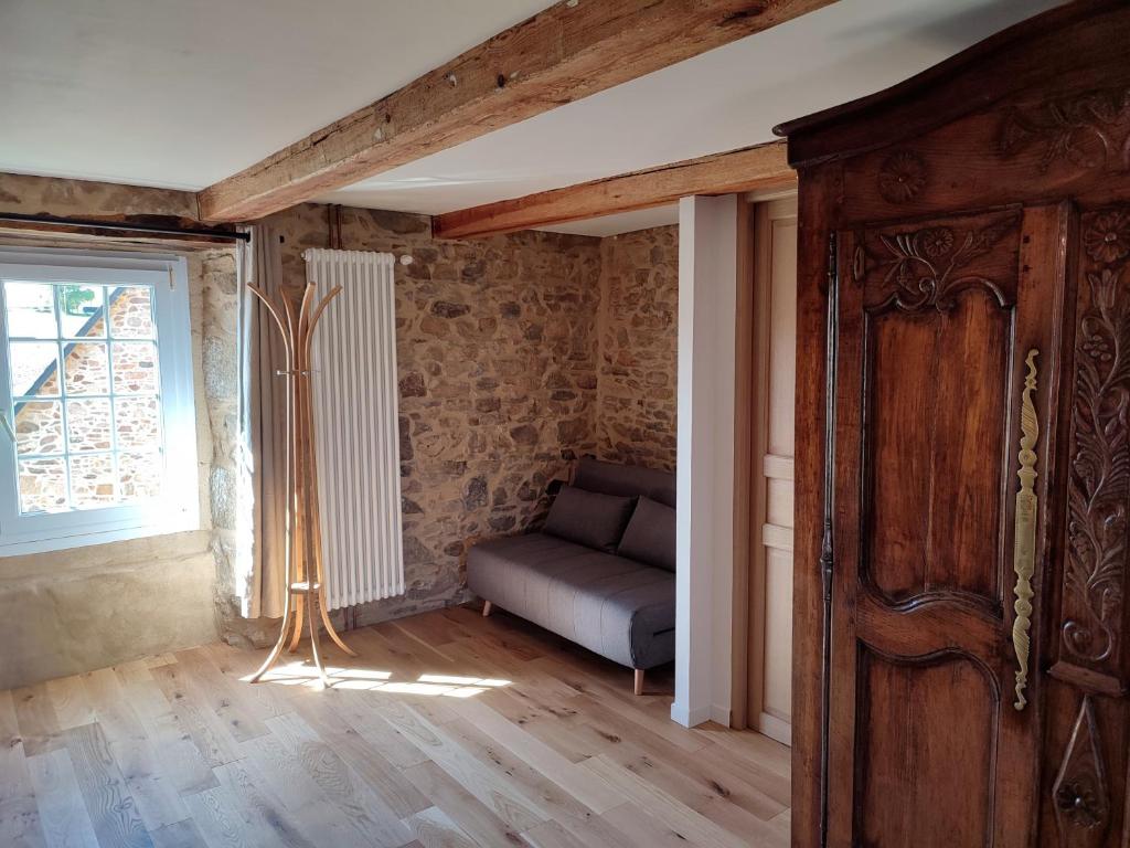 Postel nebo postele na pokoji v ubytování Chambres et tables d'hôtes Cornec