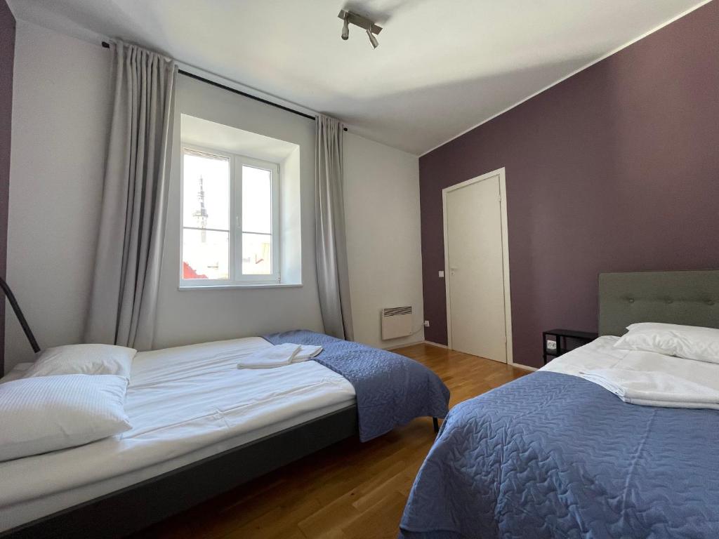 Postel nebo postele na pokoji v ubytování Old Town - Viru Apartment